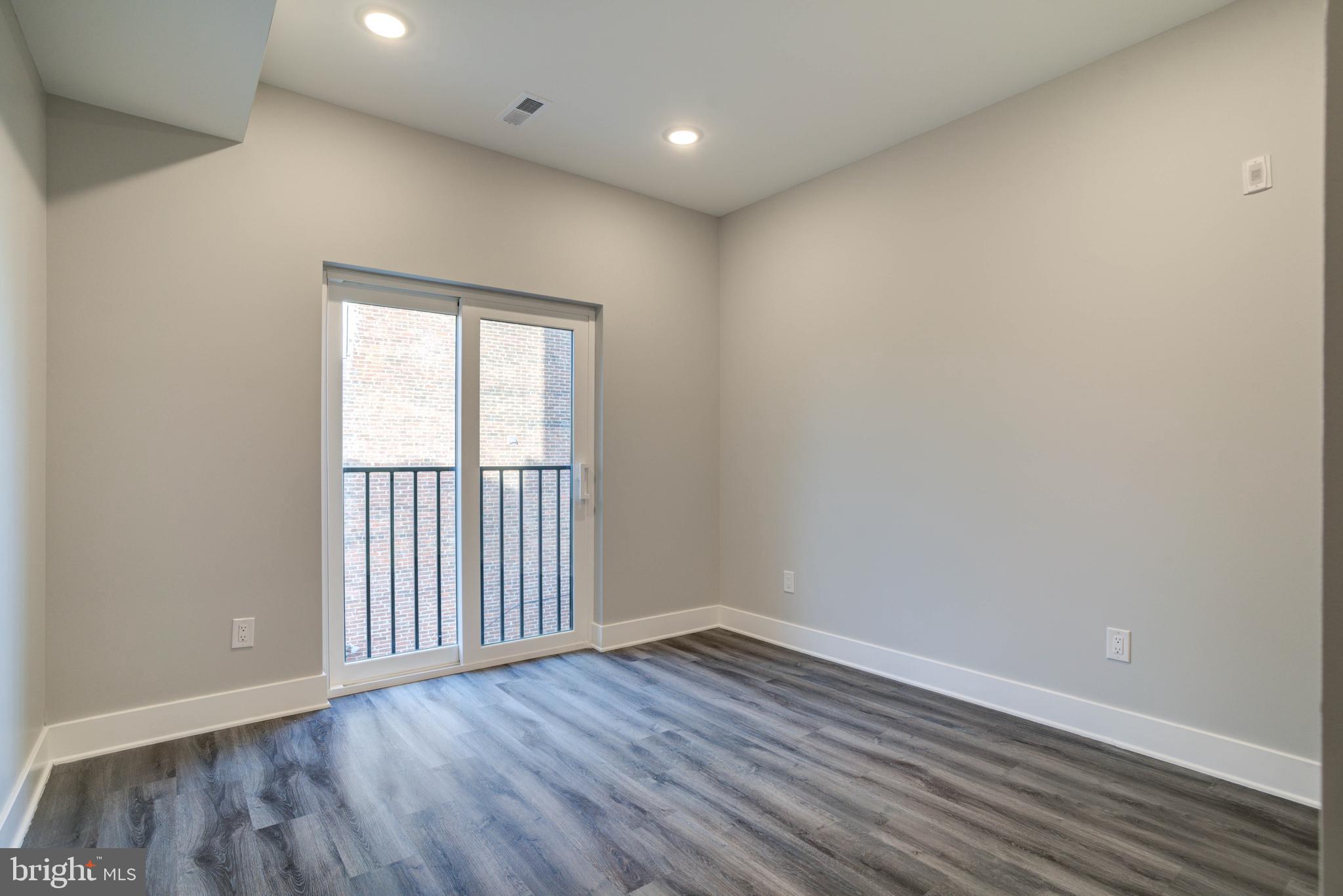5005 Walnut Street Philadelphia, PA 19139 - Photo 22 of 39 wooden floor in an empty room with a window