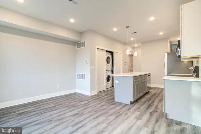 a view of kitchen with wooden floor