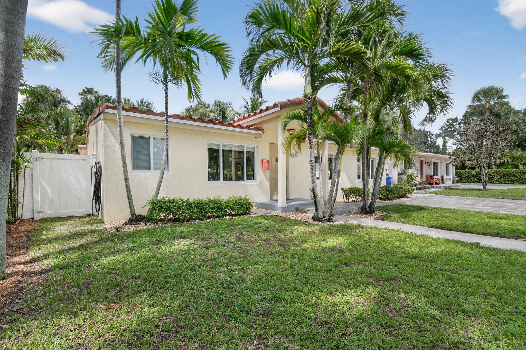 1309 Southwest 19th Avenue Fort Lauderdale, FL 33312 - Photo 2 of 66 a view of a house with a yard and palm trees