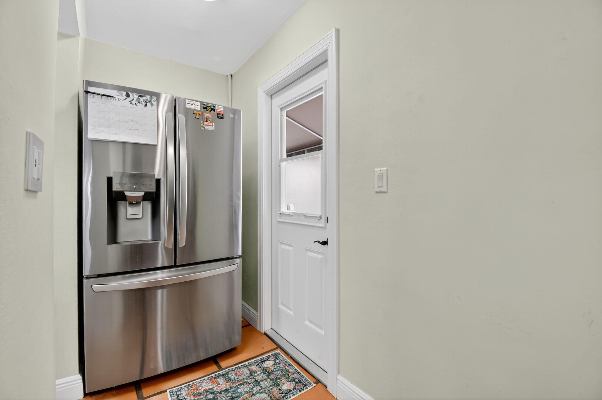 1309 Southwest 19th Avenue Fort Lauderdale, FL 33312 - Photo 21 of 66 a view of a refrigerator in kitchen and an empty room