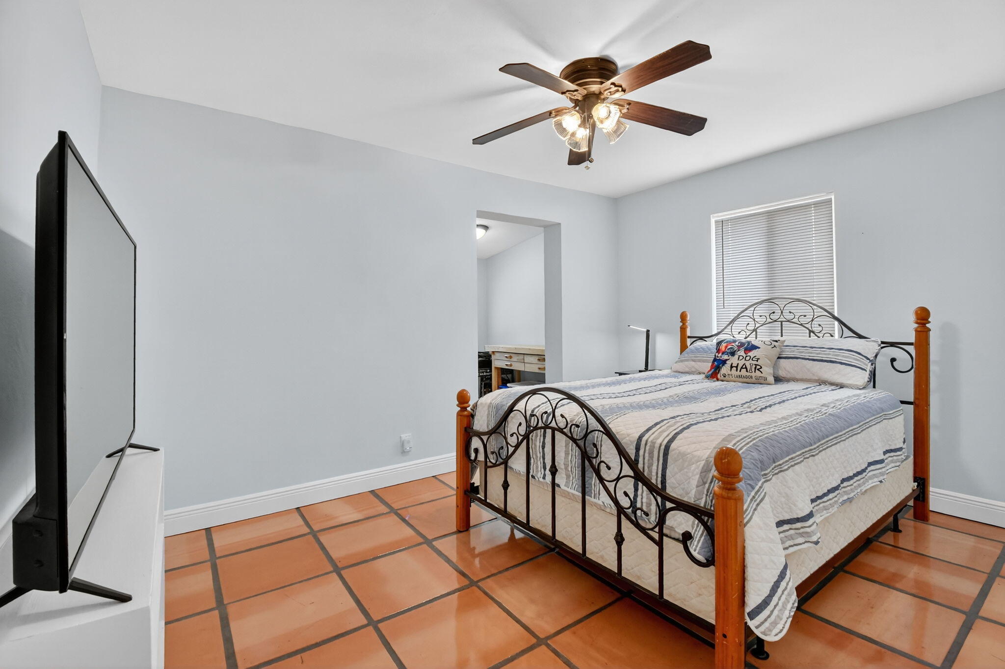 1309 Southwest 19th Avenue Fort Lauderdale, FL 33312 - Photo 27 of 66 a bedroom with a bed and a chandelier