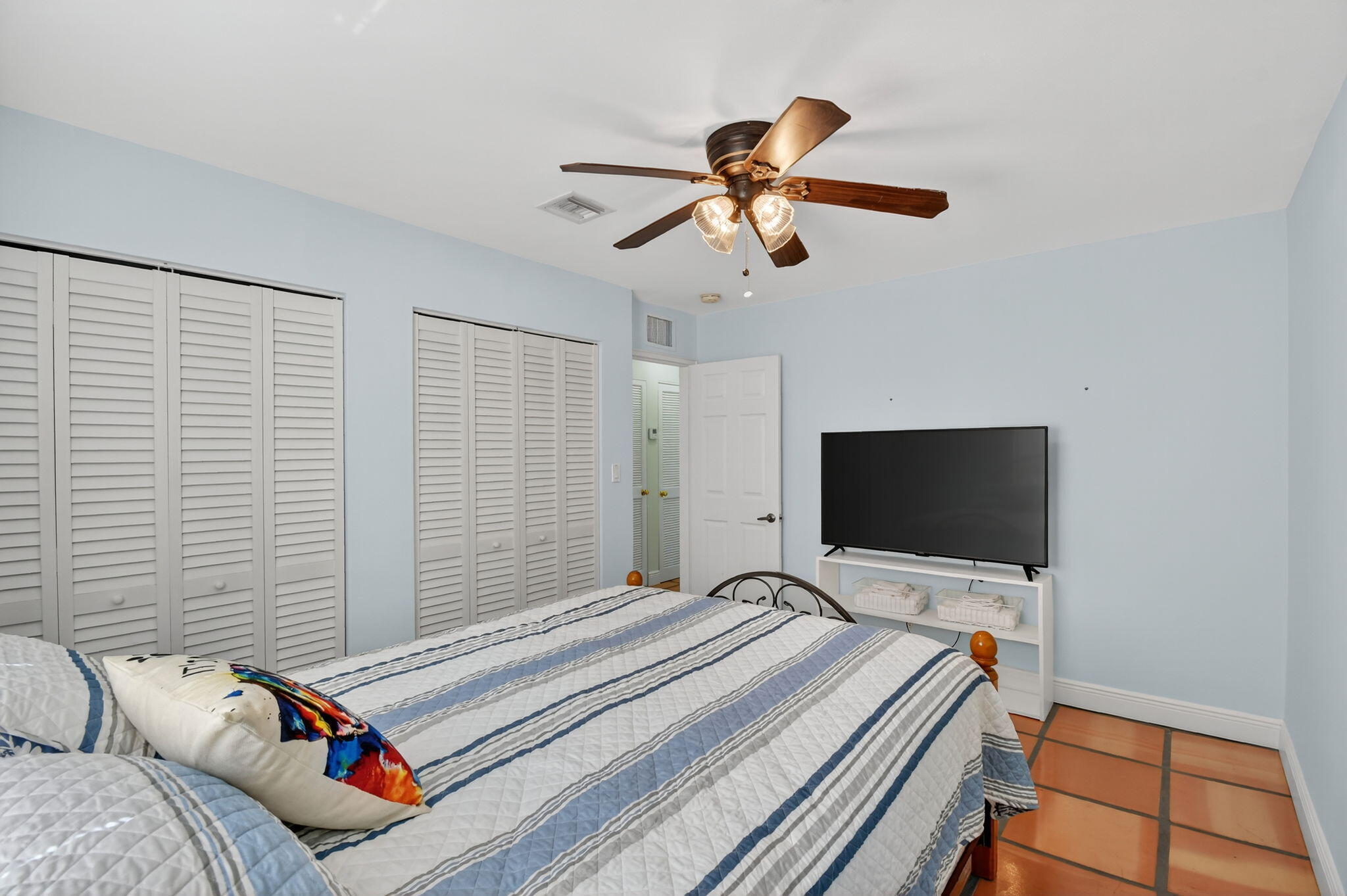 1309 Southwest 19th Avenue Fort Lauderdale, FL 33312 - Photo 29 of 66 a bedroom with a bed and a flat screen tv
