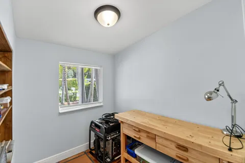 a bedroom with bed and a chandelier