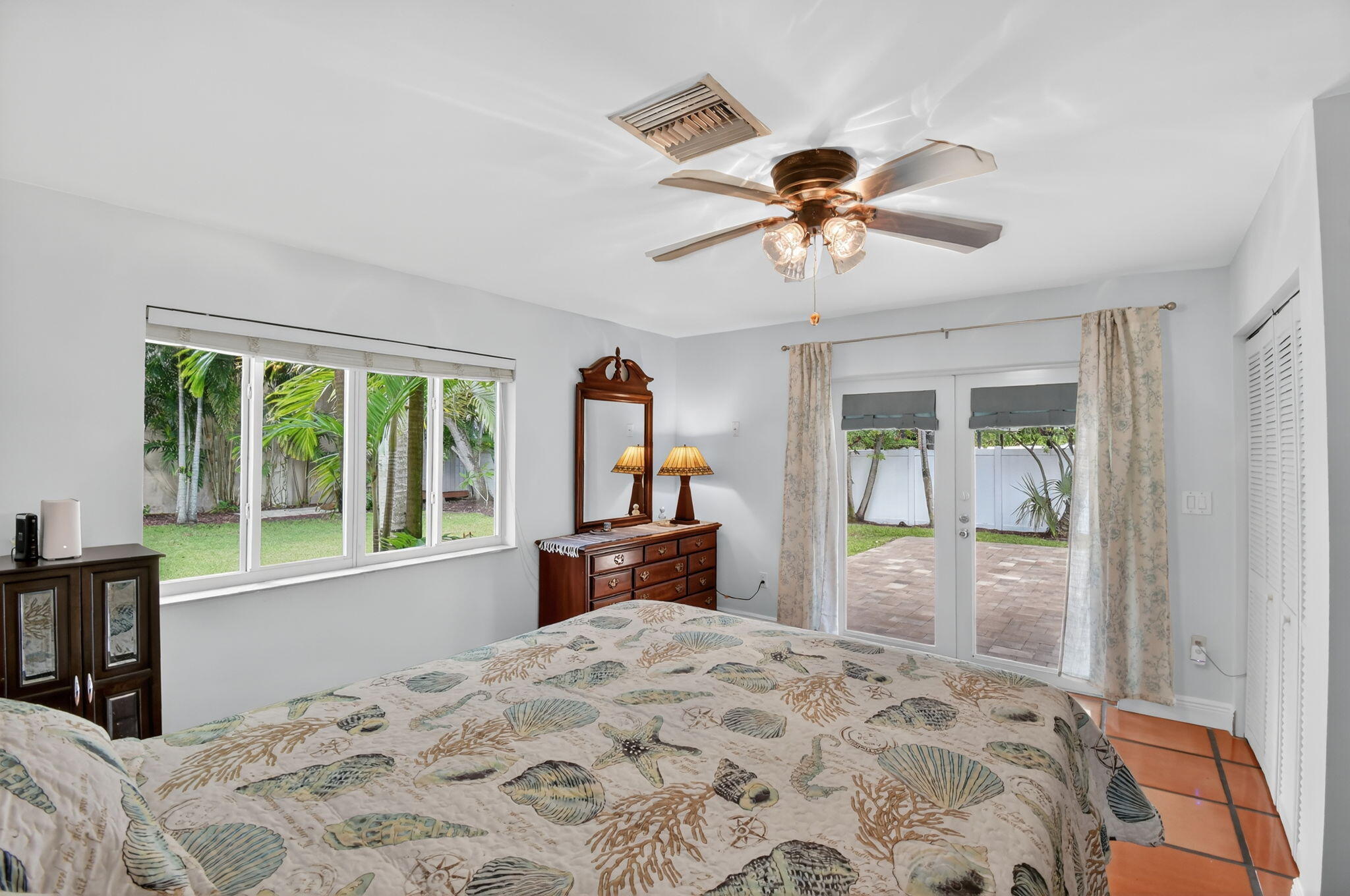 1309 Southwest 19th Avenue Fort Lauderdale, FL 33312 - Photo 36 of 66 a bedroom with a bed and a large window with the outer view