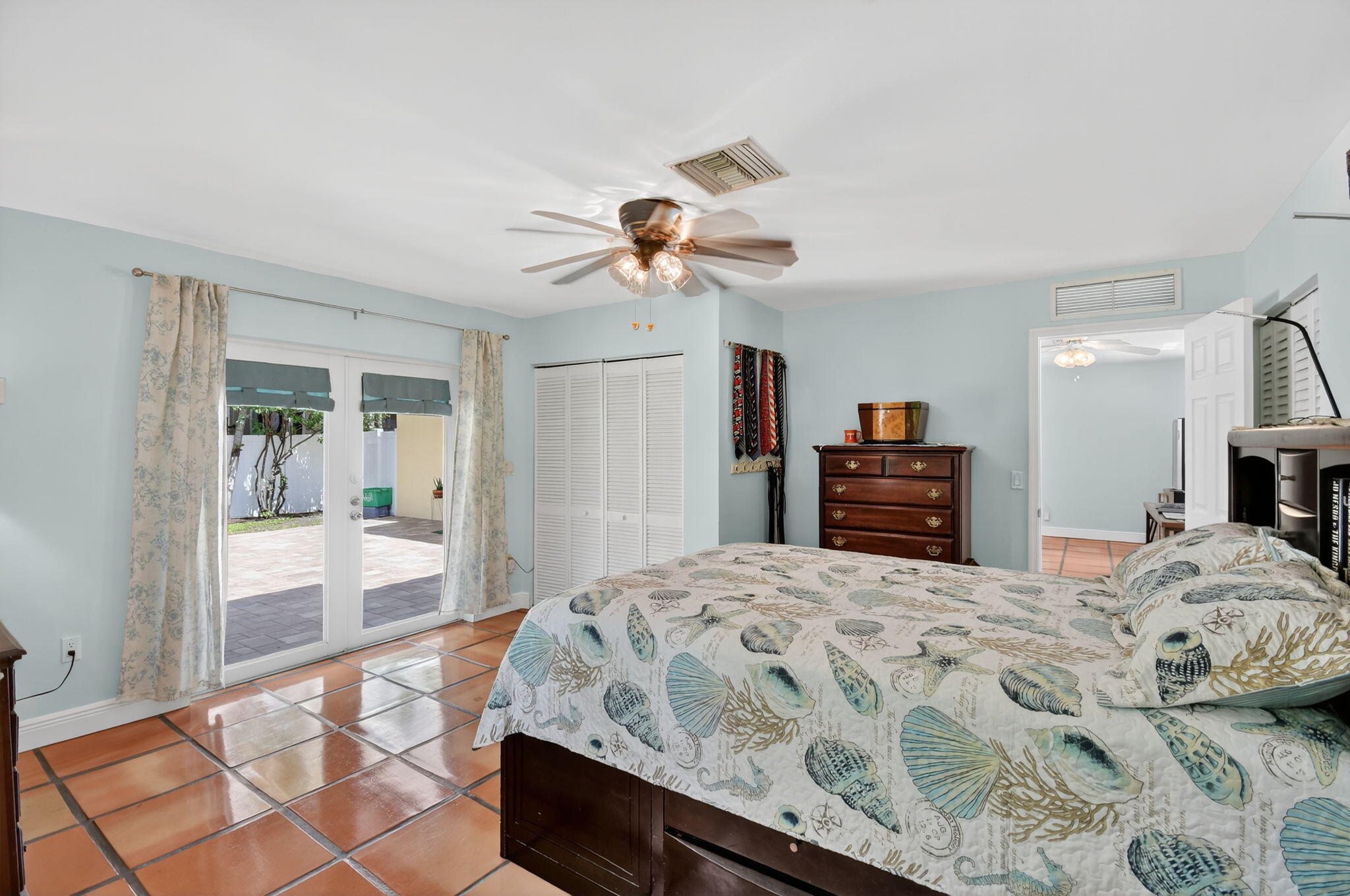 1309 Southwest 19th Avenue Fort Lauderdale, FL 33312 - Photo 38 of 66 a bedroom with bed and a chandelier