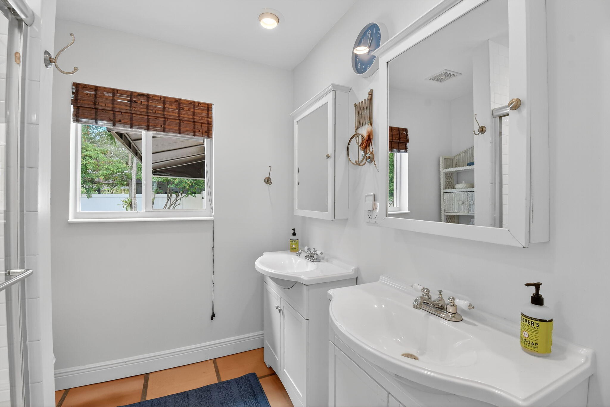 1309 Southwest 19th Avenue Fort Lauderdale, FL 33312 - Photo 39 of 66 a bathroom with a sink and a mirror