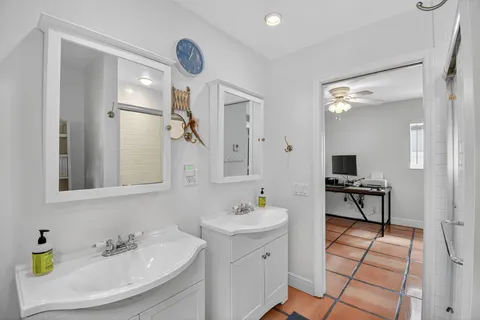 a view of a house with backyard and a tree