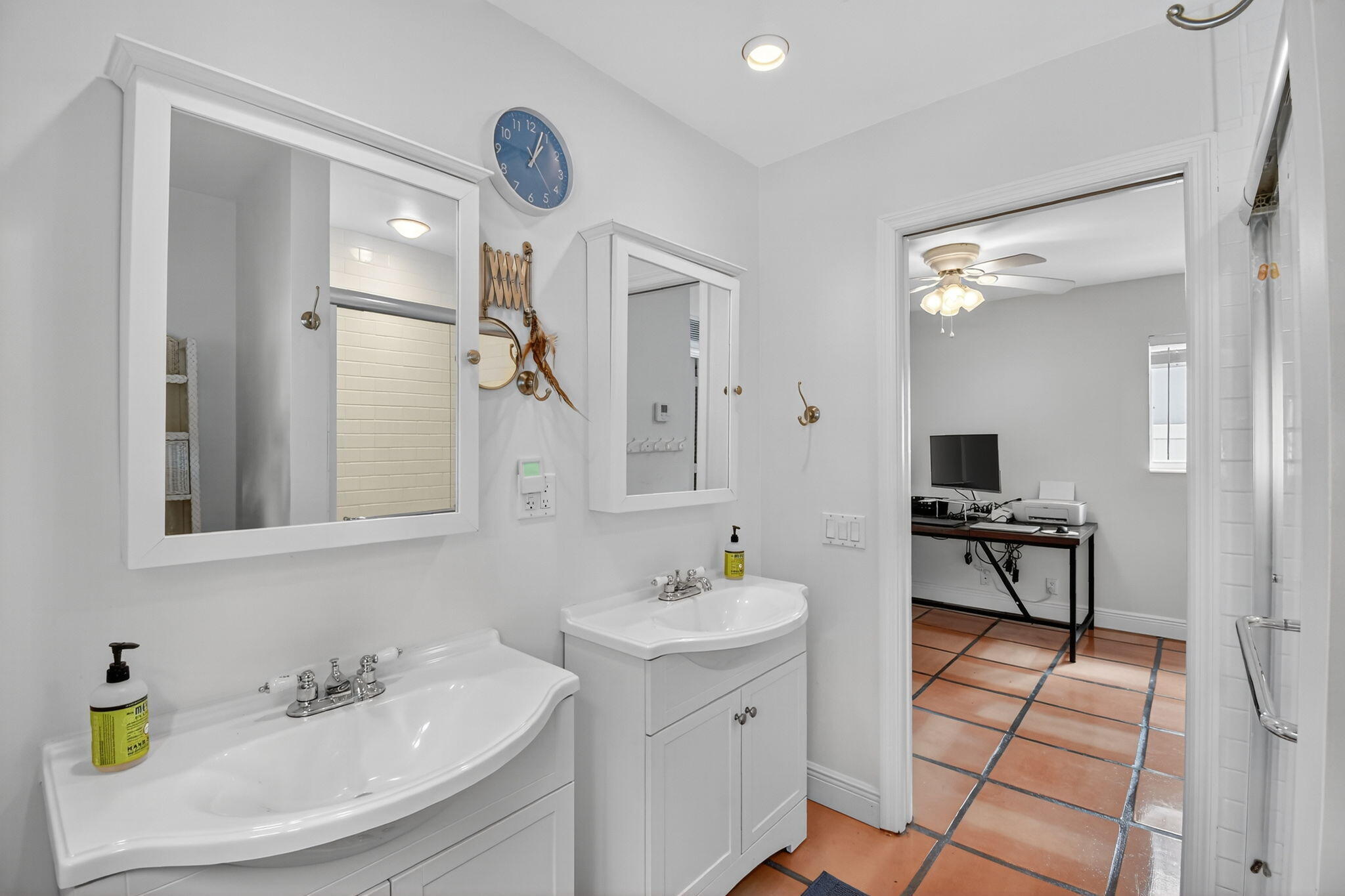 1309 Southwest 19th Avenue Fort Lauderdale, FL 33312 - Photo 40 of 66 a bathroom with a sink a toilet and a mirror