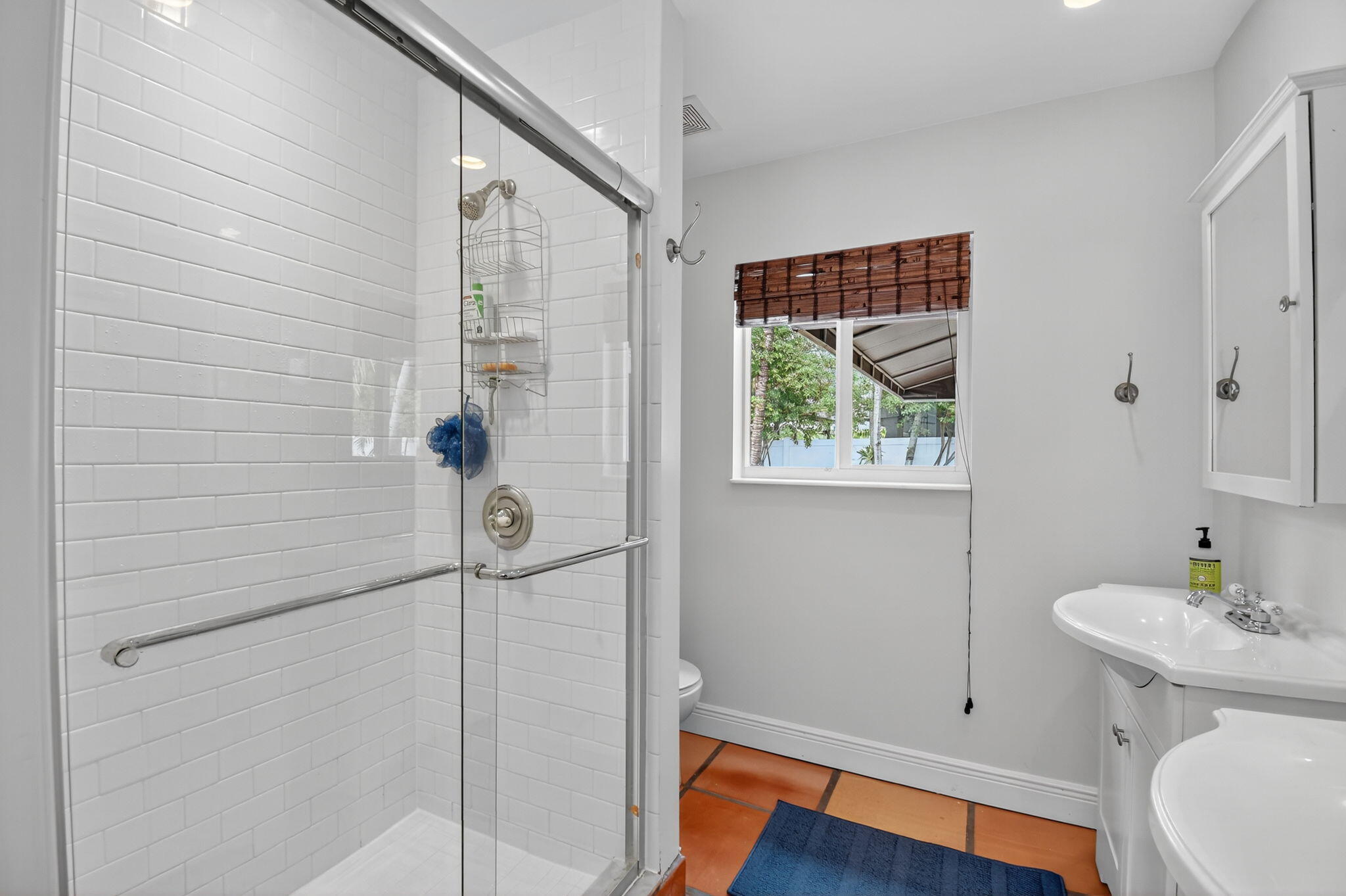 1309 Southwest 19th Avenue Fort Lauderdale, FL 33312 - Photo 42 of 66 a bathroom with a toilet a sink and mirror