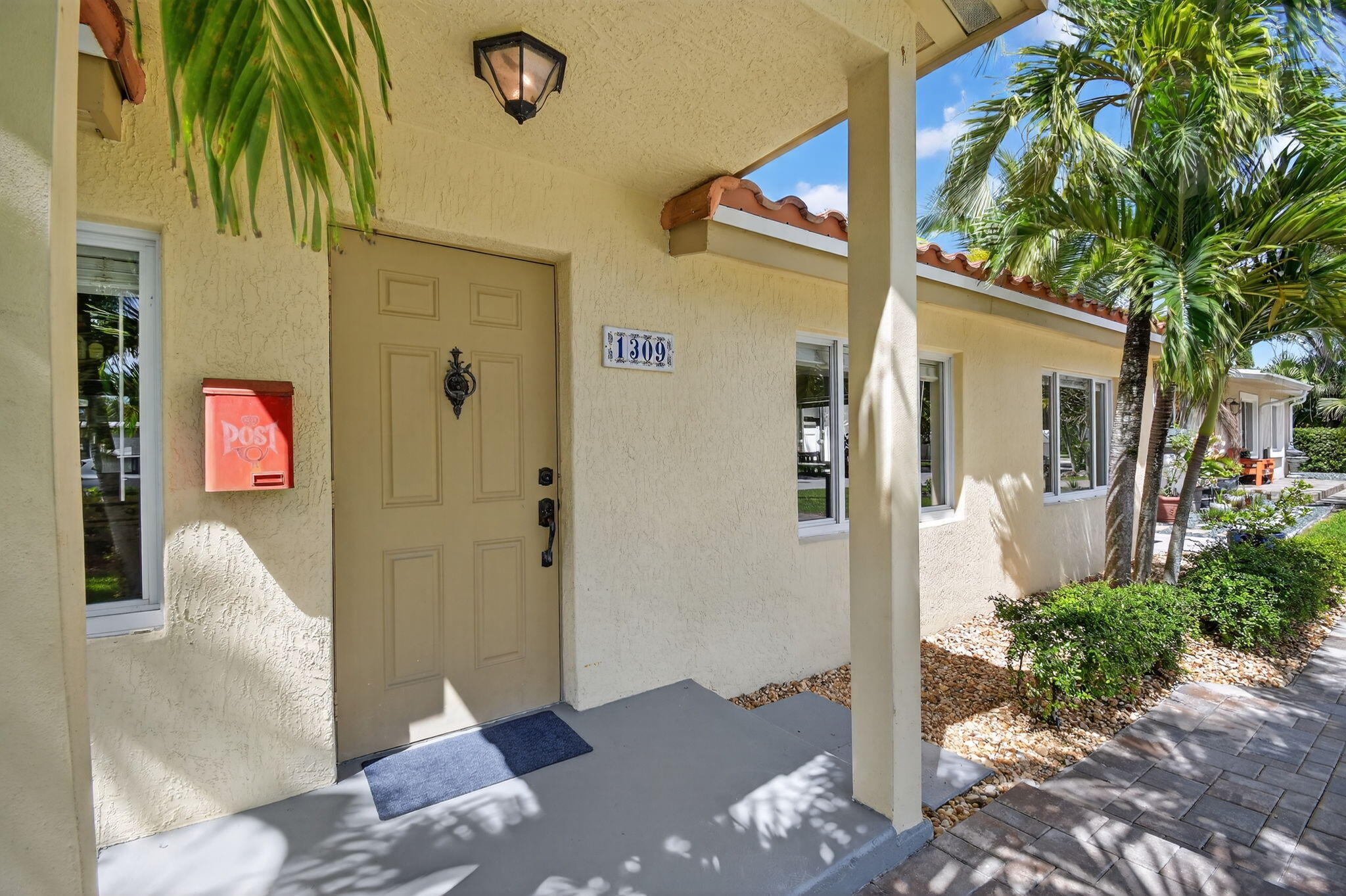 1309 Southwest 19th Avenue Fort Lauderdale, FL 33312 - Photo 5 of 66 a front view of a house with a tree