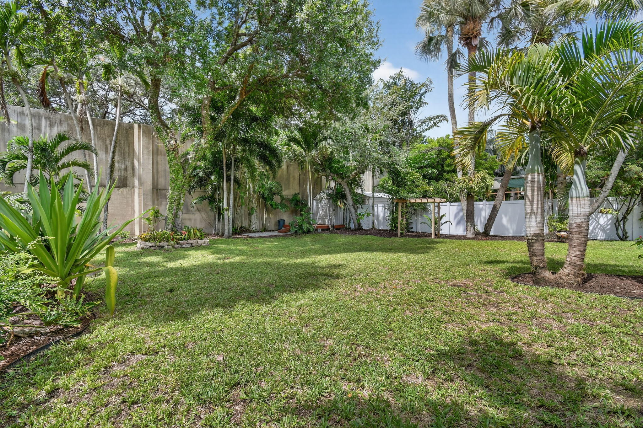 1309 Southwest 19th Avenue Fort Lauderdale, FL 33312 - Photo 52 of 66 a view of a backyard with large trees