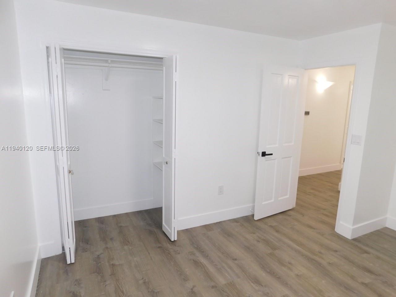 16240 Southwest 286th Street Homestead, FL 33033 - Photo 19 of 25 a view of a room with wooden floor
