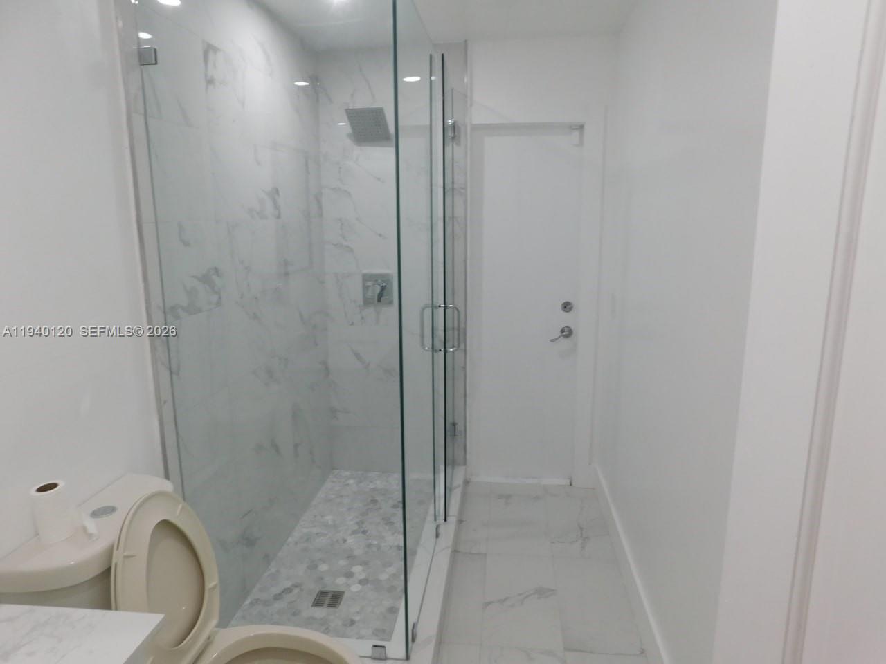 16240 Southwest 286th Street Homestead, FL 33033 - Photo 25 of 25 a bathroom with a granite countertop bathtub shower and toilet