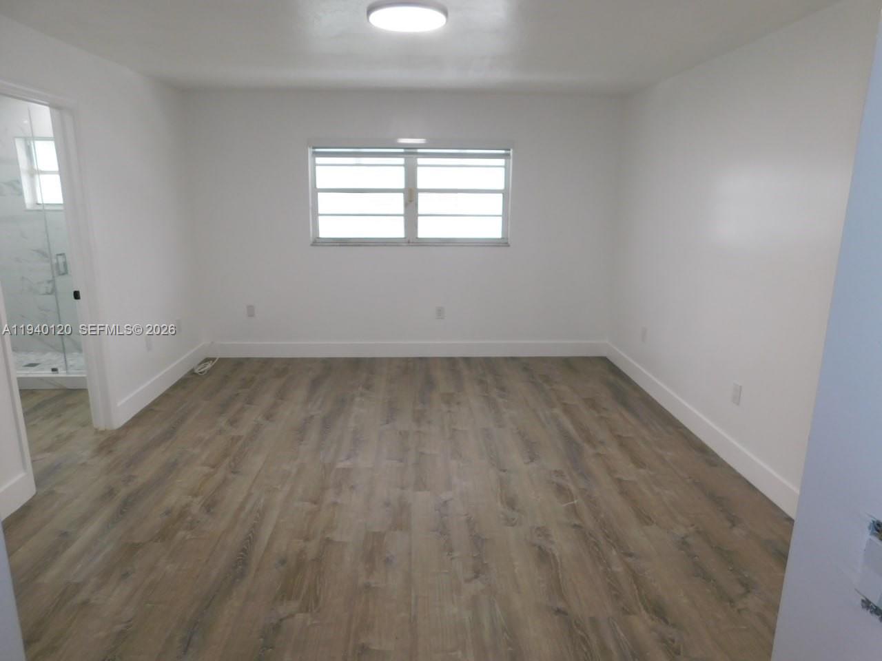 16240 Southwest 286th Street Homestead, FL 33033 - Photo 6 of 25 an empty room with a window