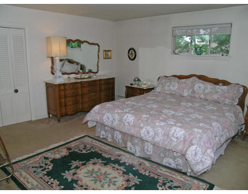 26 Nancy Road Newton, MA 02467 - Photo 8 of 11 a bedroom with a bed and a dresser