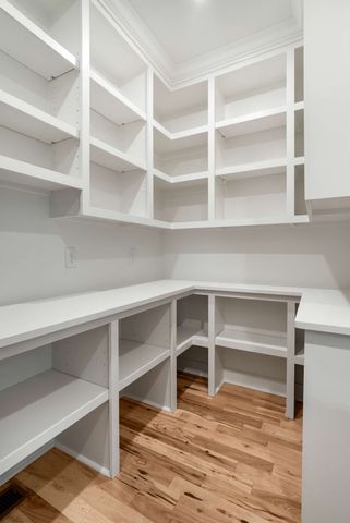 a living room with furniture a fireplace and a floor to ceiling window