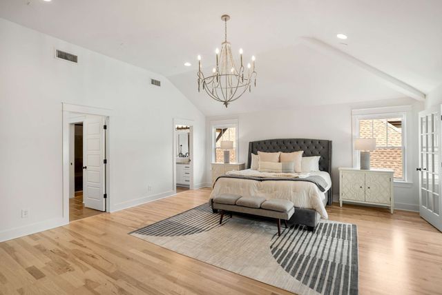 a view of an empty walk in closet and a window