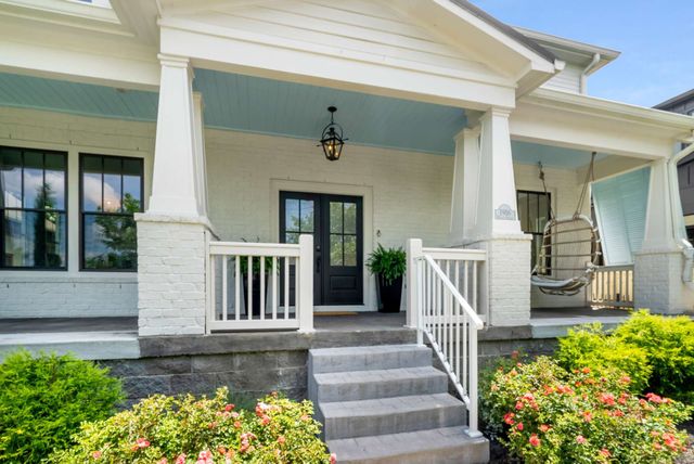a view of a dining room with furniture and windows