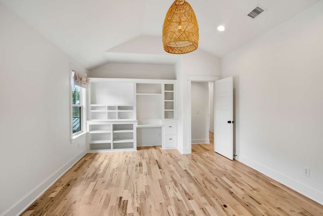 a view of a room with a large tree