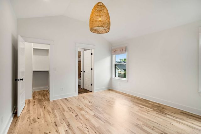 a view of house with backyard and glass windows