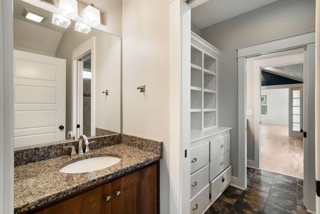 a view of a backyard with sitting area and garden