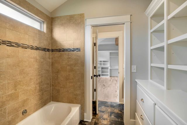 an aerial view of residential houses with outdoor space and swimming pool