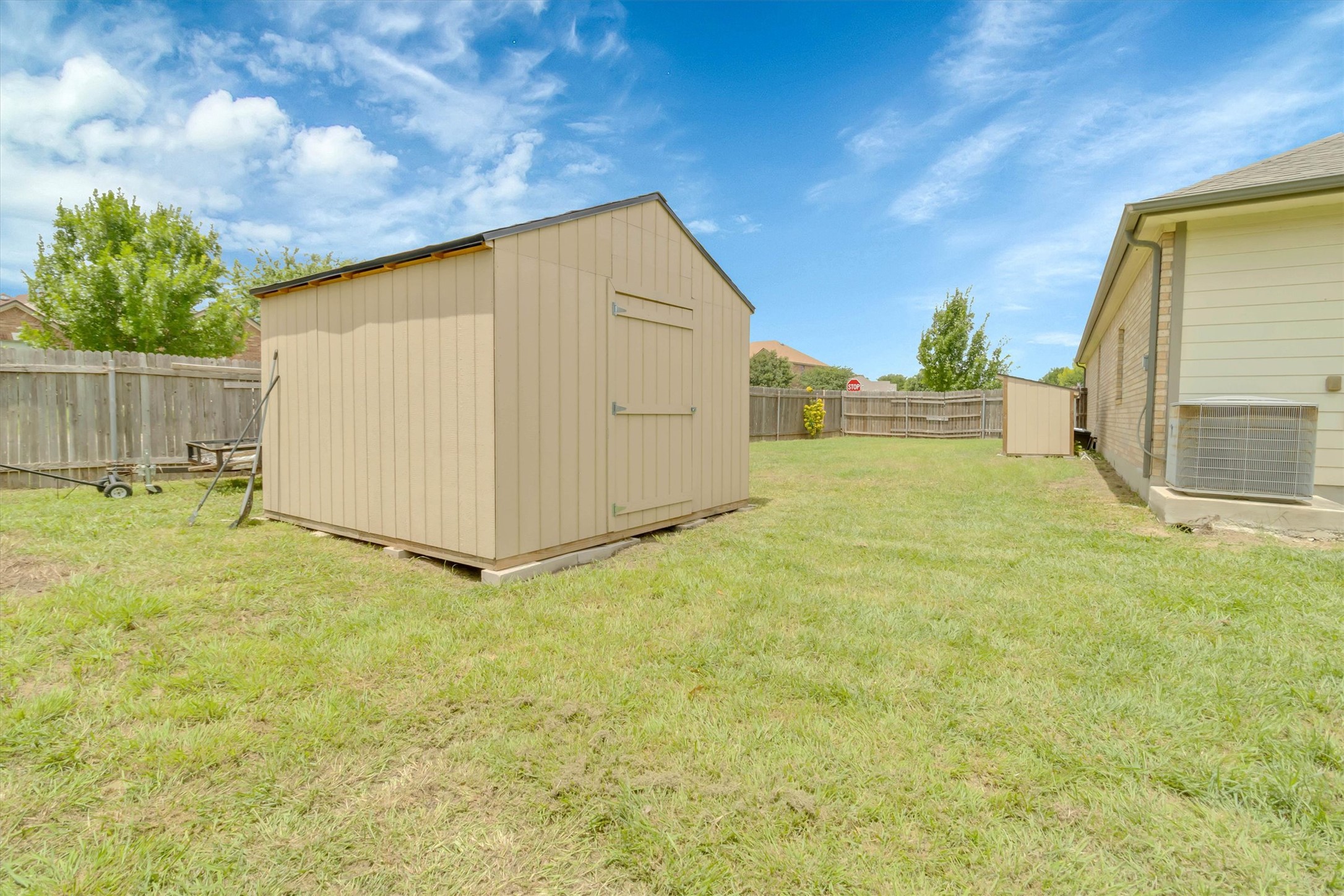 460 Waterleaf Boulevard Kyle, TX 78640 - Photo 25 of 30 A spacious backyard provides ample green space for activities and outdoor enjoyment.