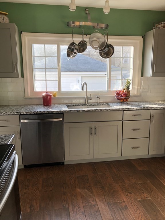 24 Daviston Street Springfield, MA 01108 - Photo 11 of 38 a kitchen with a sink and cabinets