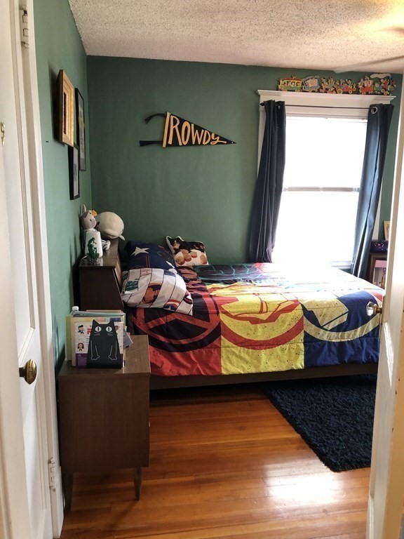 24 Daviston Street Springfield, MA 01108 - Photo 19 of 38 a bedroom with a bed and a window