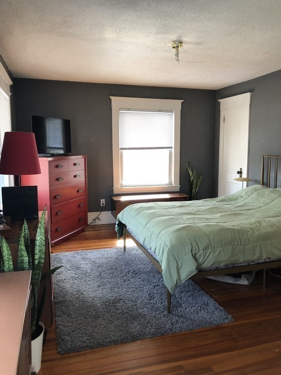 24 Daviston Street Springfield, MA 01108 - Photo 22 of 38 a bedroom with a bed and a window