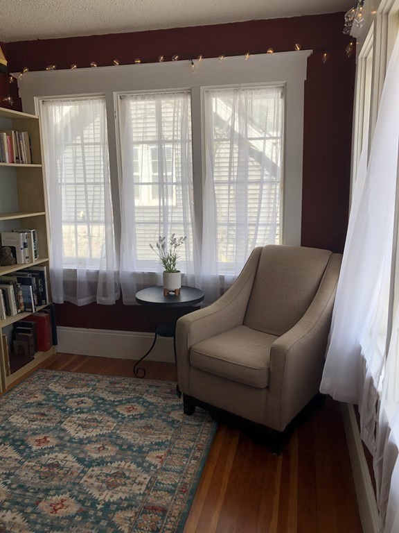 24 Daviston Street Springfield, MA 01108 - Photo 24 of 38 a living room with furniture and a large window