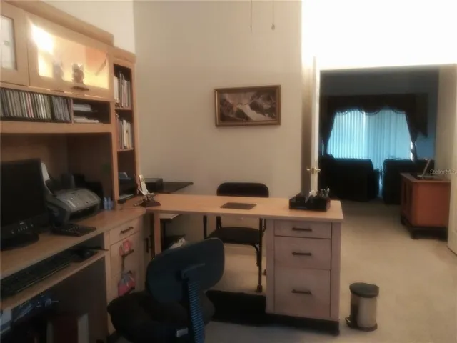 a bedroom with a bed and a mirror