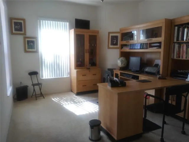 a bathroom with a bathtub shower sink vanity and mirror