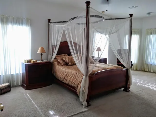 a bathroom with a tub a toilet and a sink