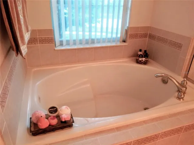 a kitchen with granite countertop cabinets and black appliances