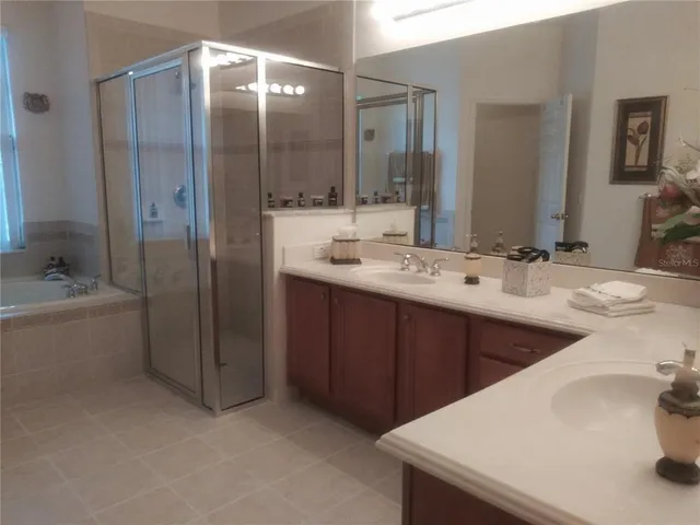 a kitchen with granite countertop a refrigerator and a sink