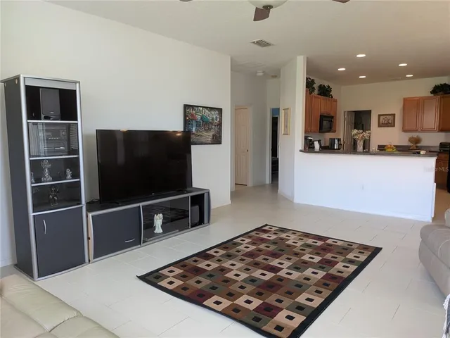 a front view of house with yard and lake view