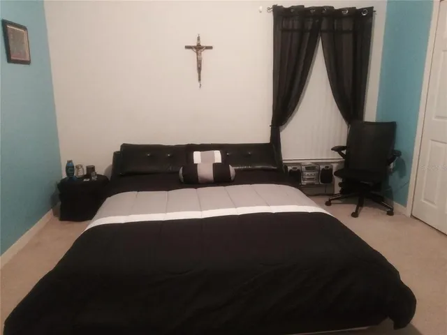 a view of a house with swimming pool and porch with furniture