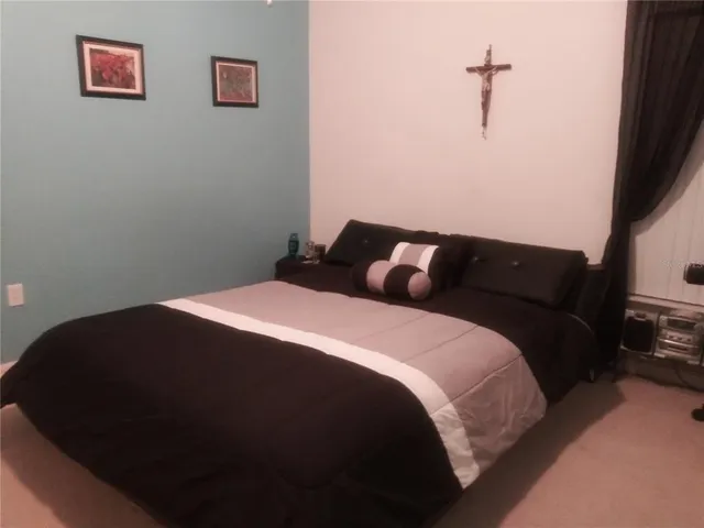 a room with gym equipment and large mirror