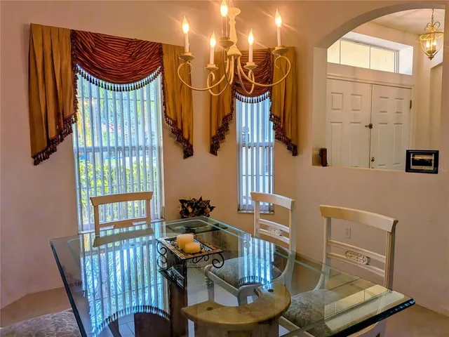 a view of a room with furniture and wooden floor