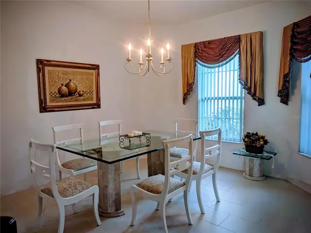 a living room with furniture and a lamp