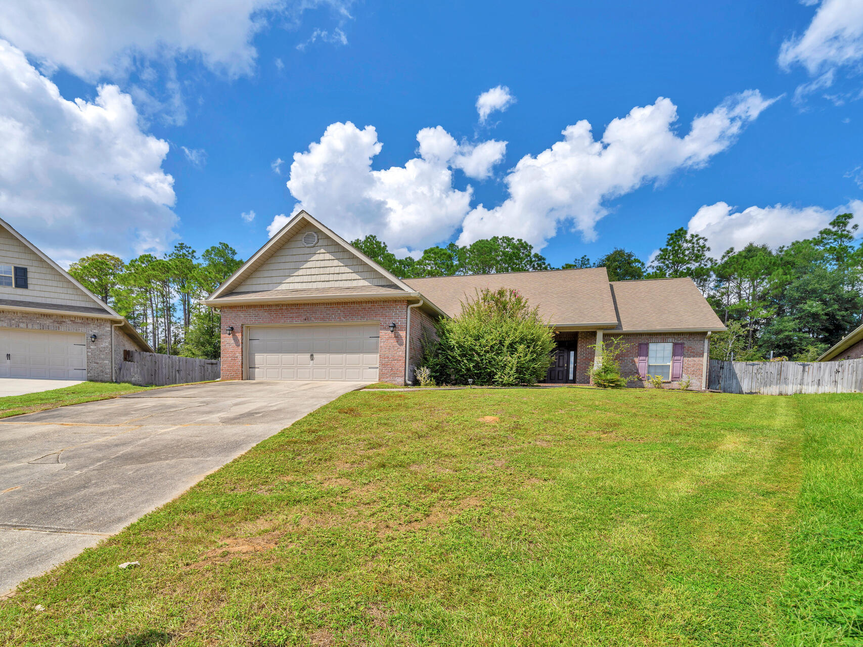 612 Rowan Circle Crestview, FL 32536 - Photo 1 of 32 a front view of a house with garden
