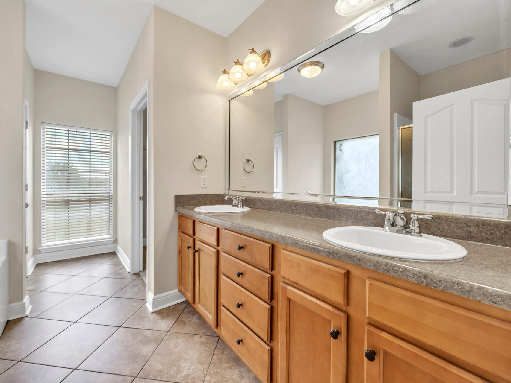 612 Rowan Circle Crestview, FL 32536 - Photo 18 of 32 a bathroom with a granite countertop sink mirror and double