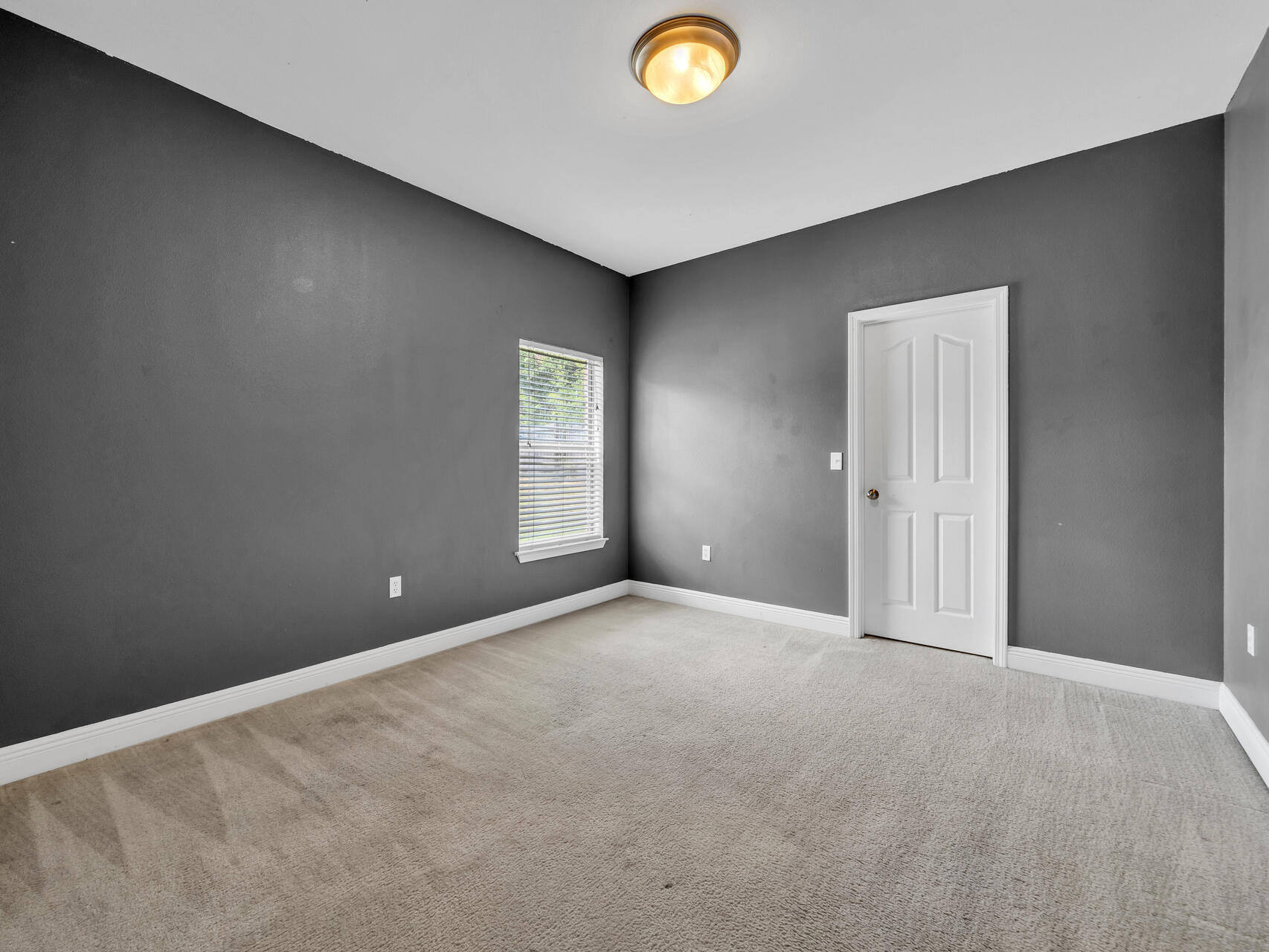 612 Rowan Circle Crestview, FL 32536 - Photo 23 of 32 an empty room with windows