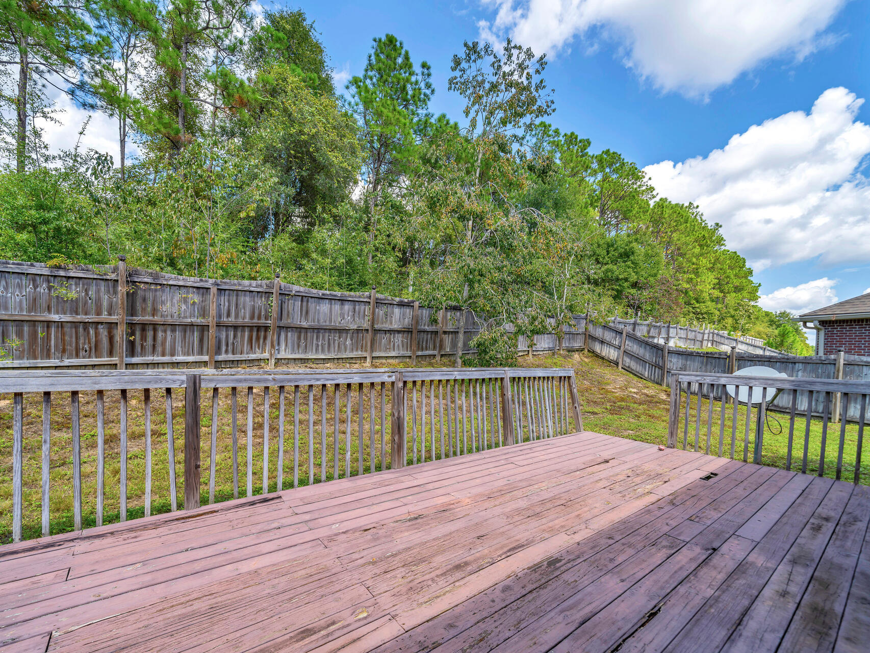 612 Rowan Circle Crestview, FL 32536 - Photo 30 of 32 a view of a wooden deck