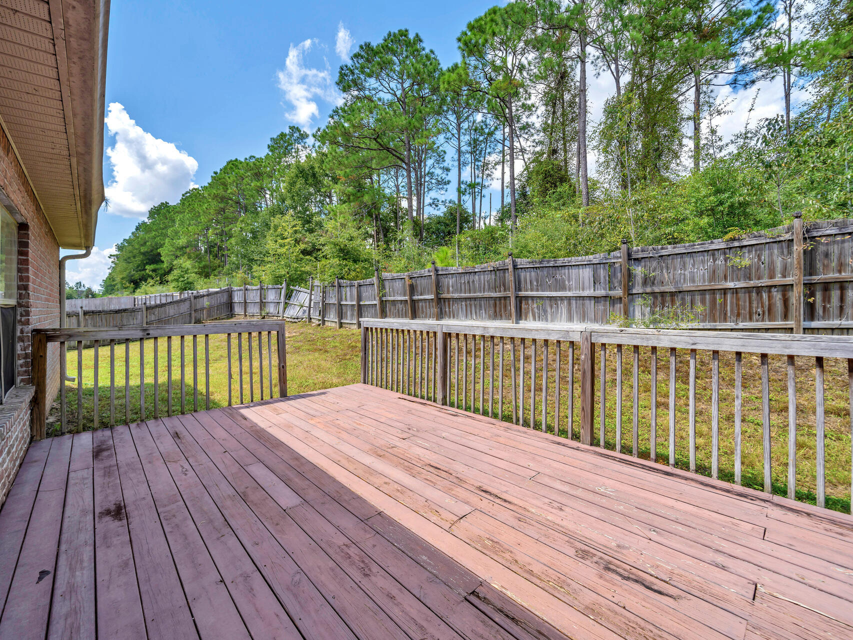 612 Rowan Circle Crestview, FL 32536 - Photo 31 of 32 a view of wooden deck and a lake view