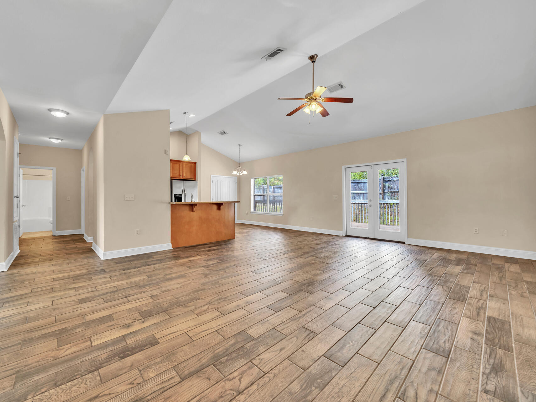 612 Rowan Circle Crestview, FL 32536 - Photo 8 of 32 a view of empty room with wooden floor