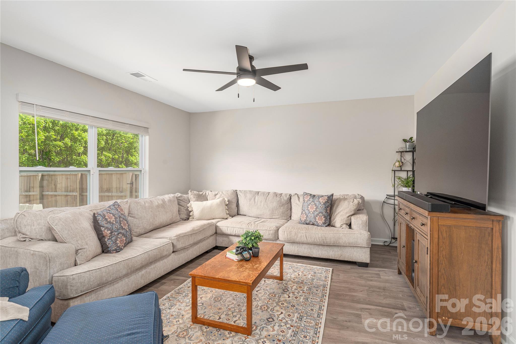 8 Madelyn Drive Clyde, NC 28721 - Photo 11 of 43 a living room with furniture a flat screen tv and a large window