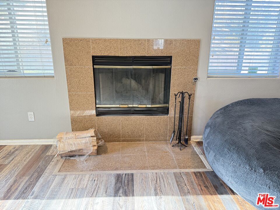 18238 Kalin Ranch Drive Victorville, CA 92395 - Photo 11 of 33 a living room with a couch and a rug