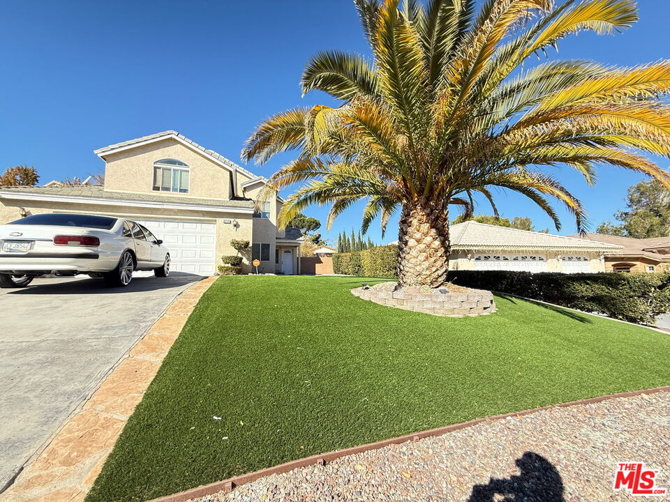 18238 Kalin Ranch Drive Victorville, CA 92395 - Photo 2 of 33 a view of a house with a yard